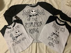 three matching shirts with the words, mom of the pumpkin king and queen of the pumpkin king