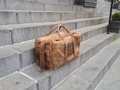 Large travel handcrafted in NYC sewn by hand from beginning to end. No glues or machines used in production. Fully customizable. Made with leather and love. More leather traveling bags, leather weekenders, leather overnight bags, leather duffle, leather suitcases, handmade leather luggage here: http://etsy.me/1eYE4hv This bag is large but it does not feel heavy because its only made out of two pieces of leather. Its raw inside, no lining. When you have thick natural leather you do not need linin Rectangular Waxed Canvas Travel Bag, Handmade Leather Satchel For Travel, Handmade Brown Travel Bag For Everyday Use, Rectangular Leather Weekender Bag With Waxed Finish, Rectangular Leather Travel Bag With Waxed Finish, Handmade Vegetable Tanned Leather Shoulder Bag For Travel, Vintage Hand-stitched Travel Satchel, Rectangular Hand-stitched Travel Bags, Leather Overnight Bag