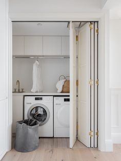 a laundry room with a washer and dryer in the closet next to each other