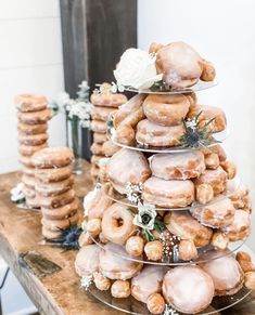 a stack of donuts sitting on top of a wooden table