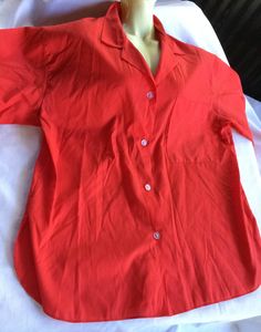 Red Polyester and Cotton blend oxford short sleeve blouse, size 18. Please take a look at my storefront at: https://www.etsy.com/shop/FabFinds42?ref=seller-platform-mcnav I have a wide selection of one-of-a-kind items, from clothing and toys to home decor and gift items, and I add new things almost every day. Red Collared Top For Summer, Classic Short Sleeve Solid Color Blouse, Classic Short Sleeve Solid Blouse, Classic Short Sleeve Blouse, Red Cotton Short Sleeve Shirt For Spring, Red Collar Blouse For Work, Red Shirt For Summer Daywear, Red Collared Short Sleeve Shirt For Summer, Red Collared Shirt For Summer