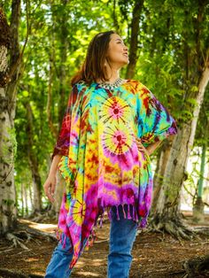 Indulge in the unique charm of our hand-dyed tunic top, meticulously crafted for those who appreciate exceptional fashion. Made from 100% breathable and comfy rayon, this stunning piece is designed to elevate your style while ensuring absolute comfort. Our tunic top stands out with its one-of-a-kind hand-dyed method, guaranteeing that no two pieces are exactly alike. Embracing a loose silhouette, it offers a versatile fit that flatters a wide range of sizes, from S to 2XL. With its side-stitched Bohemian Colorful Poncho For Festival, Bohemian Style Colorful Festival Poncho, Bohemian Colorful Festival Poncho, Free Size Tie Dye Kaftan For Festival, Multicolor Summer Festival Poncho, Summer Festival Multicolor Poncho, Tie Dye Tunic Kaftan For Festival, Festival Tie Dye Tunic Kaftan, Bohemian Hand Dyed Kaftan For Festivals