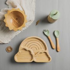 an assortment of wooden utensils and spoons on a table