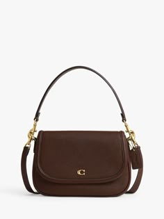 A smart shoulder bag perfect for work and weekends alike, choose this sleek piece from Coach. Crafted from leather with two detachable straps, it fastens with a secure flapover front with a signature Coach charm. Coach Tabby Wristlet, Coach Legacy Bag, Brown Coach Bag, Luxury Bags Collection, Coach Legacy, Girly Bags, Pretty Bags