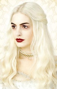 a woman with long white hair and red lips