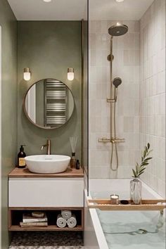 a bathroom with a sink, mirror and bathtub in the middle of the room