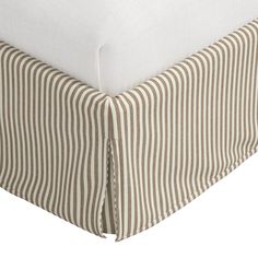 the bed skirt is made with ticking fabric