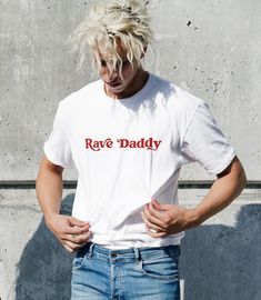 -Gildan 5000 Brand Shirts -Unisex Adult Sizing -Props used in photos are NOT included with purchase Check out this design on other products! Sweatshirts: https://www.etsy.com/listing/1435859000/rave-daddy-sweatshirt-festival?click_key=ec7a7c87e8a938bbd4b71de25f79f6abfb1975df%3A1435859000&click_sum=91105e3d&ref=shop_home_active_6&pro=1 Fiber Composition -Solid colors are 100% cotton; Heather colors are 50% cotton, 50% polyester (Sport Grey is 90% cotton, 10% polyester); Antique colors are 60% cot Rave Shirts, Embroidery T Shirt, T-shirt Broderie, Skate T Shirts, Festival T Shirts, Funny Tshirts, Cotton Tee, Short Sleeve Tee, Classic T Shirts