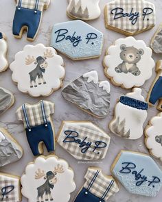 baby shower cookies are arranged on a table