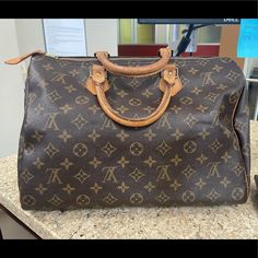 Louis Vuitton Vintage Monogram Canvas Speedy 30 Satchel Color: Brown Height: 9.5 Length: 12.5 Material: Canvas Width: 7 Pre-Owned With No Rips Or Tears. This Bag Is In Excellent Condition! No Stains On The Inside Of The Bag. This Comes With The Lock And Keys But No Dust Bag Or Box. The Handles Are A Little Darkened As Well. Louis Vuitton Speedy 25 Monogram, Large Black Purse, Louis Vuitton Satchel, Louis Vuitton Papillon, Louis Vuitton Red, Louis Vuitton Speedy 30, Louis Vuitton Damier Azur, Vintage Monogram, Vintage Louis Vuitton