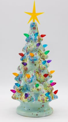 This is a, 11" tall lighted ceramic Christmas tree.  Each one painted by me with the highest quality of glazes, and fired to a beautiful finish.  Every piece is one of a kind, and signed by Suze on the bottom.   Each tree comes with attached base and a lighting kit. It contains a star, mini light inserts to put in the Ceramic Trees, Vintage Ceramic Christmas Tree, Ceramic Cafe, Holiday Swag, Colourful Christmas, Ceramic Tree, Ceramic Projects, Have A Holly Jolly Christmas, Mini Light