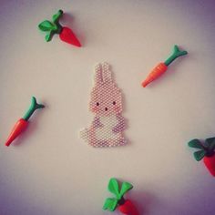 some carrots and a bunny made out of beads