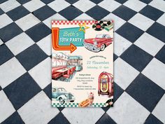 an old fashioned birthday party card on a checkered floor