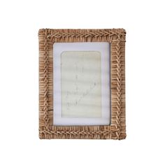 a wicker frame with an old paper in the middle and a handwritten message on it