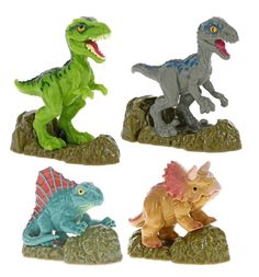 four dinosaur figurines sitting on top of rocks