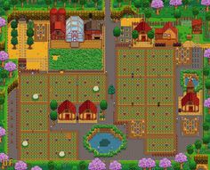 an aerial view of a farm with lots of trees and buildings