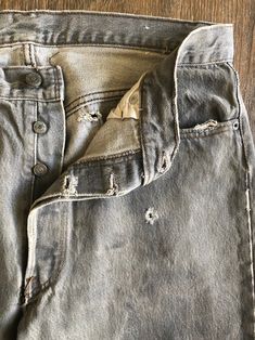 Vintage 501 Levi's Distressed Black Denim Jean Pants Original San Fransisco Made Levi's Denim Tag Reads Men's Size : W 36 L 34 Made in USA Willing to Answer Any and All Questions about Items. All Items Sold AS IS. No Refunds. No Returns. Note* Items are not laundered unless adopted personally before selling, to reduce costs & to help combat the ongoing drought in California. For More Photos & Other Items Visit : ikilledKiki.com Distressed Light Wash Rigid Denim Bottoms, Light Wash Distressed Rigid Denim Bottoms, Distressed Rigid Denim Blue Bottoms, Distressed Straight Leg Dark Wash Bottoms, Straight Leg Distressed Dark Wash Bottoms, High Rise Distressed Rigid Denim Bottoms, Rugged Denim Bottoms With Belt Loops, Faded Denim Bottoms With Button Closure, Ripped Dark Wash Rigid Denim Bottoms