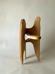 a wooden chair with a white ring on it