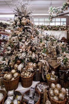 a christmas tree surrounded by baskets filled with ornaments