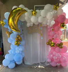 balloon arch with moon and stars on it