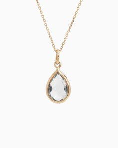 The Dewdrop Pendant boasts a distinctively timeless design, featuring a pear-shaped white topaz stone cradled in 14K solid gold. Whether worn on its own for understated elegance or paired with a pair of Dewdrop Stone Earrings for a coordinated look, this pendant adds a touch of sophistication to any outfit. Metal: 14K solid gold Stone: White topaz Dimensions: 25mm x 10mm Style #: GP195W Refined Teardrop Jewelry For Anniversary, Classic Birthstone Drop Jewelry, Classic Teardrop Rose Cut Diamond Jewelry, Classic Faceted Drop Jewelry, Classic Drop Jewelry With Faceted Details, Modern Teardrop Rose Cut Diamond Jewelry, Classic Everyday Pear-shaped Jewelry, Hook Bracelet, Island Vibes