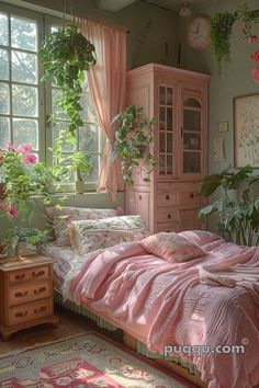 a bedroom with pink bedding and plants in the window sill, next to a dresser