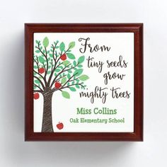 an apple tree with the words from tiny seeds grow mighty trees on it, framed in a wooden frame