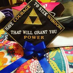 a graduation cap that says, have courage to seek wisdom that will grant you power