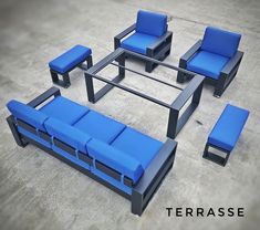 a set of blue couches and chairs on the ground