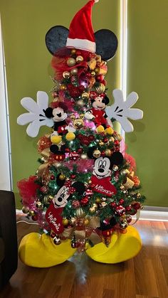 a christmas tree with mickey mouse decorations