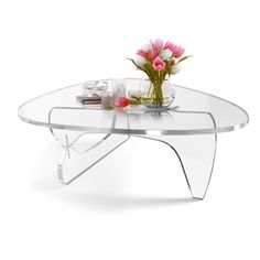 a glass table with pink flowers on it