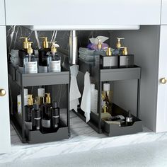 two black shelves with bottles and soaps on them next to each other in a bathroom