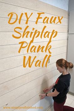 a woman standing next to a wall with the words diy faux shiplap plank wall on it