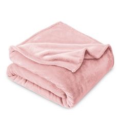 a pink blanket folded on top of each other