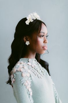 a woman with flowers in her hair