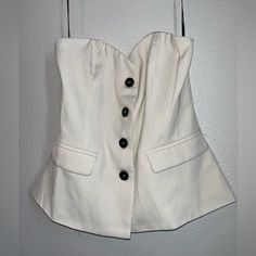 Forever 21 Strapless White/Cream Vest| Size M Condition: Nwt Button Down Vest Chic Strapless Top With Buttons, Chic Strapless Top With Button Closure, Fitted Strapless Top With Buttons, Chic Beige Tops With Snap Buttons, White Tops With Buttons For Night Out, Spring Night Out Top With Snap Buttons, Strapless Spring Tops With Buttons, Chic Beige Tops From Forever 21, Chic White Forever 21 Outerwear