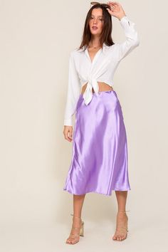 This luxuriously elegant skirt, with a silhouette that gently cascades down to a flirtatious, mid-calf length. Its wondrous blend of lustrous satin and a cinched elastic high waistband offers an enchanting flair that's both flattering and comfortable. A true masterpiece that will leave onlookers in awe with its mesmerizing flow and refined style. This is the flare midi satin skirt that you have been longing for, perfect for any occasion that calls for sophistication and class.Made in Vietnam Sty Midi Satin Skirt, Midi Flare Skirt, Chic Skirts, Satin Midi Skirt, Elegant Skirt, Refined Style, Skirt Fits, Mock Neckline, Satin Skirt