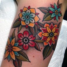 a woman's thigh with flowers on it