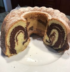 a chocolate swirl cake on a white plate