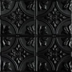 black tin ceiling tiles with floral designs on them, all in different shapes and sizes