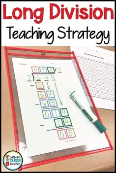 the long division teaching strategy is displayed on a table with a marker and clipboard