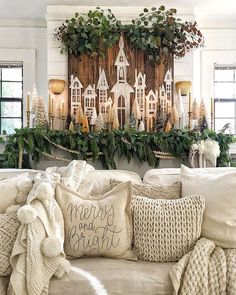 a living room filled with lots of furniture and christmas decorations on top of a mantle