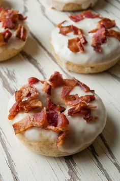 four donuts covered in bacon and white frosting