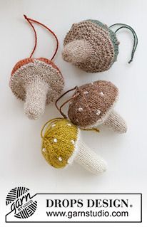 four knitted mushrooms sitting on top of a white surface with the words drops design above them