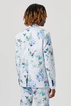 Bloomin' gorgeous. The Pickhurst blue suit jacket was designed to make sure you stand out in the crowd - we just knew you needed another floral suit to add to your collection. Cut from a lightweight cotton blend, it's the perfect piece to bring the sunshine all year-round for occasions here or abroad. Cut with a peak lapel, straight flap pockets & double darts. When paired with the matching skinny fit trousers this jacket makes a statement. Spring Formal Suit With Floral Print, Formal Floral Print Suits For Spring, Spring Floral Print Formal Suits, Elegant Spring Blazer With Floral Print, Elegant Floral Print Blazer For Spring, Elegant Floral Print Spring Blazer, Elegant Spring Floral Print Blazer, Fitted Floral Print Blazer With Notch Lapel, Formal Floral Print Outerwear For Spring