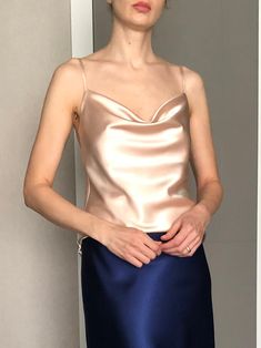 This silk satin top can be worn as a party and date dress and for many other occasions. Made of satin silk.  DESCRİPTİON:  -Adjustable straps.  -Designed for a slim but relaxed fit.  -Unlined. İt is a custom made top tailored according to your preferences. While ordering write your bust and waist measure, so the top will be made to your size. Please enquire if you're interested in different color. SIZING INFO: XS/34/US4: bust: 82-86cm (32-33 inch) waist 64-66 cm (24-25 inch)  S/36/ US6: bust: 86-88cm (33-34 inch) waist: 66-68 cm (25-26 inch) M/38/ US8: bust: 88-92 cm (34-36 inch) waist: 68-72 cm (26-28 inch) L/40/ US10:  bust: 92-94 cm (36-37 inch) waist: 72-74 cm (28-29 inch) WASH and CARE: Hand wash. Iron at high heat. Don't hesitate to contact me with any question or thought, I'd love t Satin Slip Dress With Built-in Bra For Night Out, Summer Evening Camisole With Built-in Bra, Summer Party Camisole With Built-in Bra, Cami Top With Built-in Bra For Evening, Fitted Party Camisole, Summer Party Camisole With Spaghetti Straps, Silk Tank Top With Built-in Bra For Night Out, Elegant Satin Camisole With Built-in Bra, Satin Tank Top For Summer Party