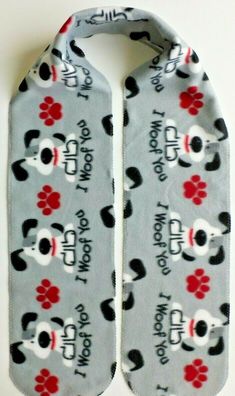 a pair of gray socks with black and white dogs on them