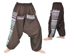 Harem pants men women Wide Leg Pants Boho Hippie Pants Aladdin Pants Handcrafted from high quality cotton Airy, super comfortable cotton pants made of light, comfortable to wear cotton. The ideal pants for leisure, sport and wherever it should be loose and comfortable :-) Special features: Elastic waist with drawstring, 2 large pockets Size: One Size fits all - elastic waist with drawstring Fits for US-Size 4 - 12 Circumference (waist): 27 - max. 40 inch Circumference (hip): up to max. 48 inch L Comfortable Brown Cotton Pants, Traditional Baggy Harem Pants With Pockets, Cotton Cargo Pants For Festivals, Cotton Harem Pants With Pockets, Brown Harem Pants With Pockets, Cotton Harem Pants With Hip Pockets And Relaxed Fit, Traditional Cotton Parachute Pants With Pockets, Brown Harem Bottoms With Pockets, Cotton Parachute Pants With Pockets For Festivals