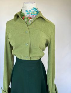 Notations Green (suede) shirt  Button down  Polyester/spandex  Vintage size small (fits modern day small or medium) Oversized fit for small or fitted medium.  Length 25" Bust 38" Waist 36" Shoulder 16" Arm 22.5" Green Suede, Green Blouse, Shirt Button, Button Shirt, Small Tops, Medium Length, Womens Clothing Tops, Polyester Spandex, Vintage 90s