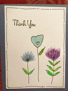 a thank you card with flowers on it